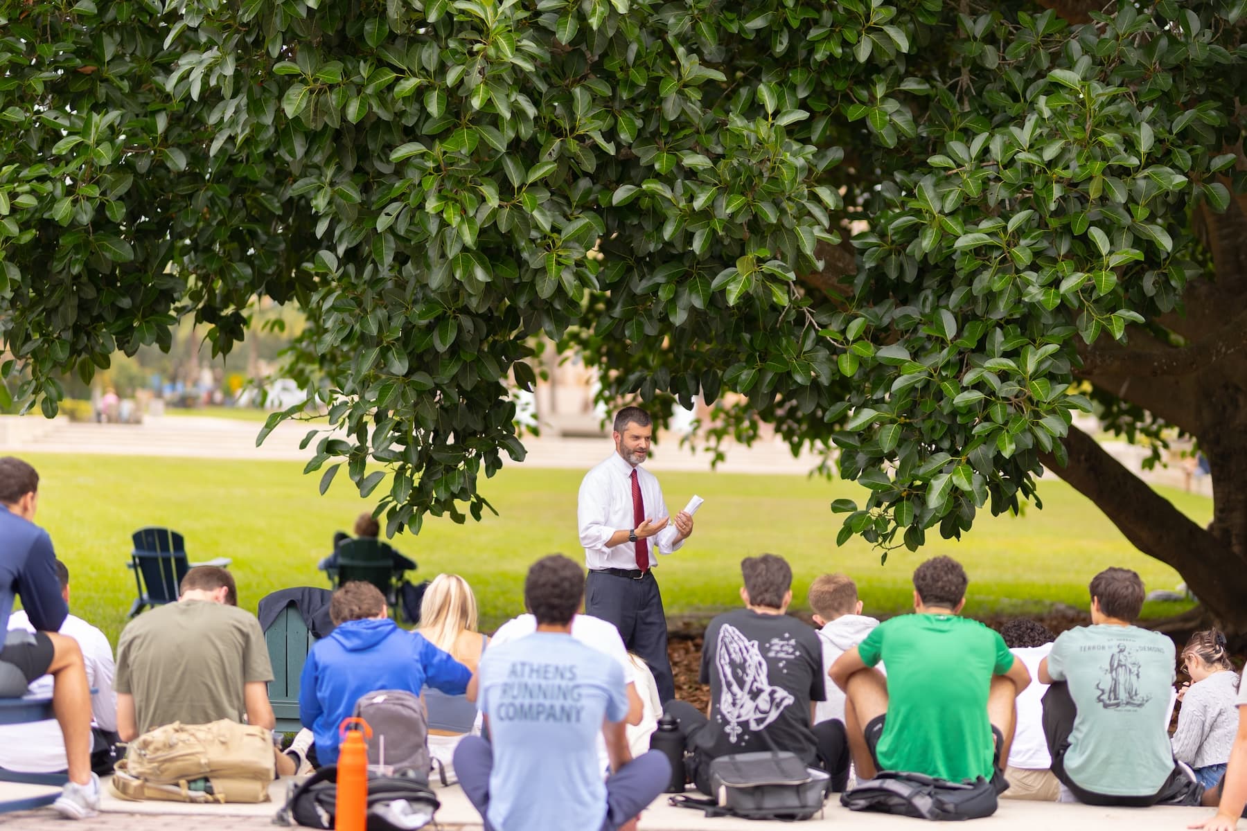 Students gathered outdoors for class at Ave Maria University