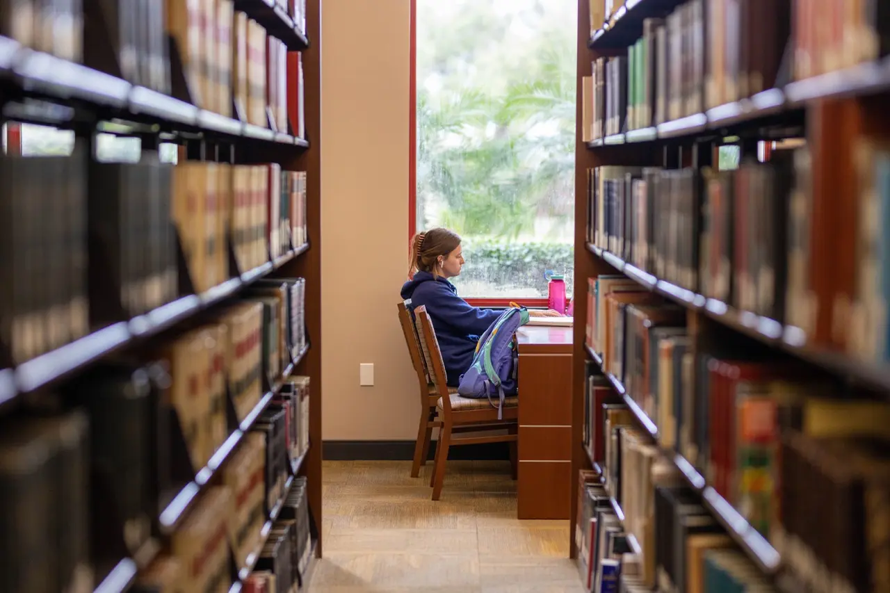 A student studying in the library